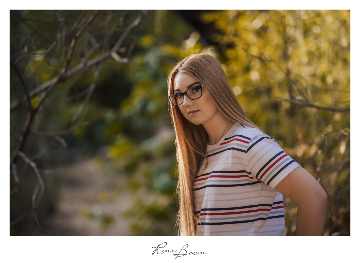teen girl with long hair and glasses