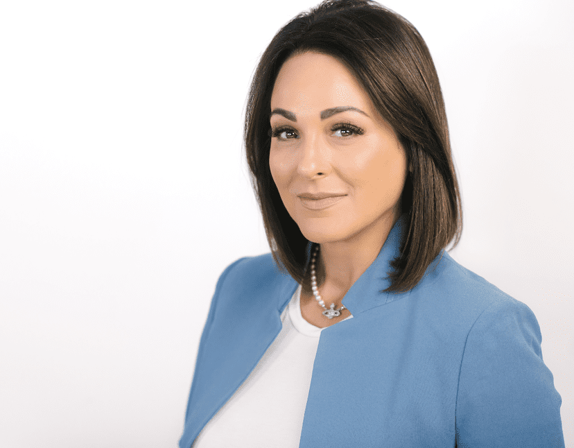 professional headshot woman in blue jacket white background