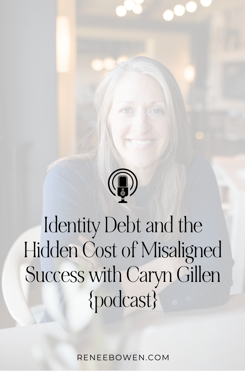 woman with long gray hair smiling at camera; she is sitting down with folded arms and is wearing a blue shirt with words on the screen that says identity debt and the hidden cost of misaligned success with caryn gillen
